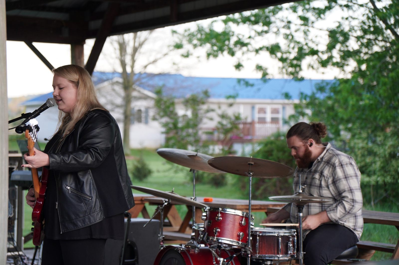 A vocalist and drummer during the worship set